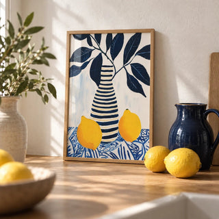 Lemon Art Print, a small A4 framed print leaning on an oak worktop in a kitchen