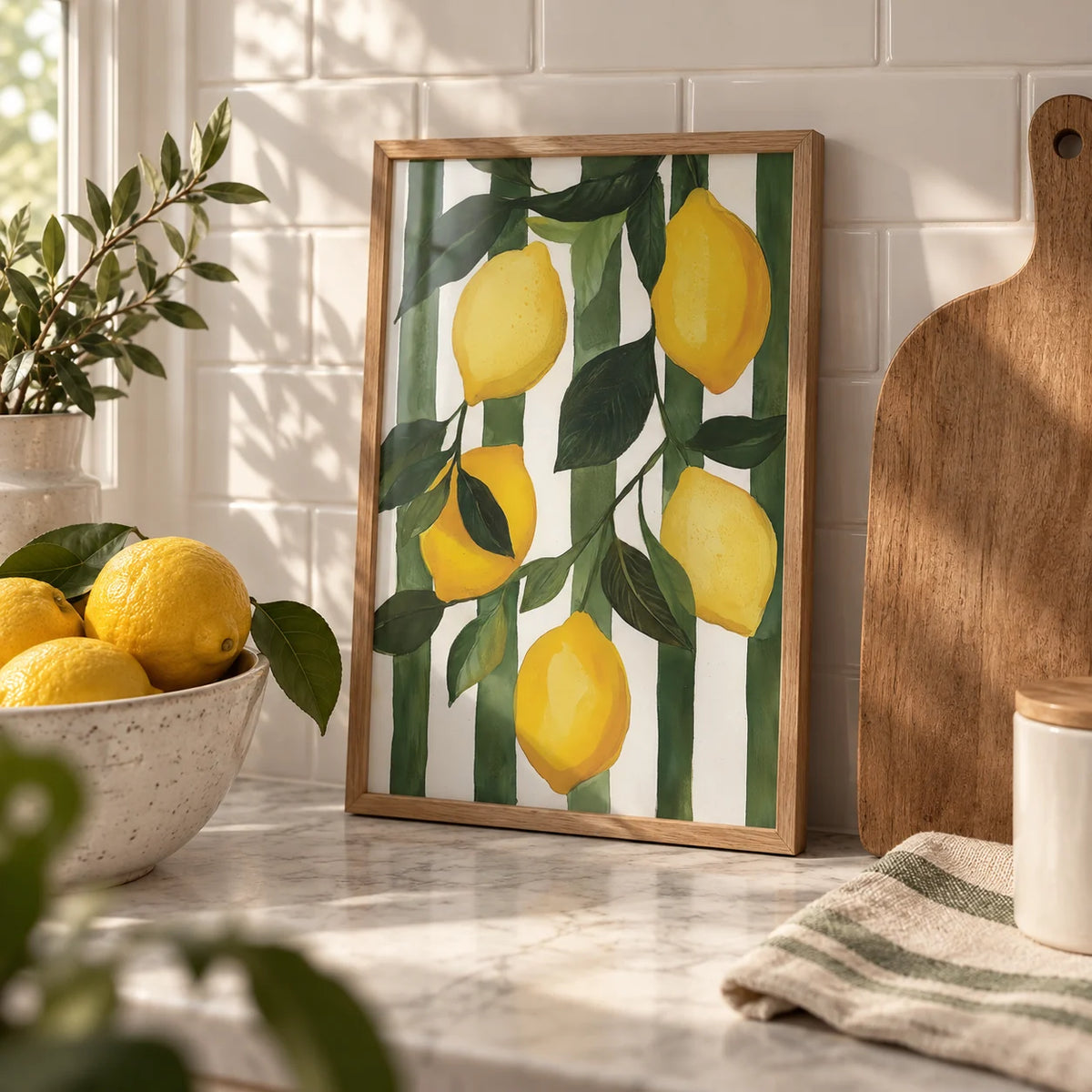 Lemon Tree Painting, a small A4 framed print leaning on a worktop in a kitchen
