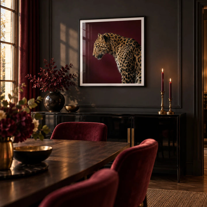 Leopard Art Print, framed on the wall of a dramatic dining room with dark charcoal walls