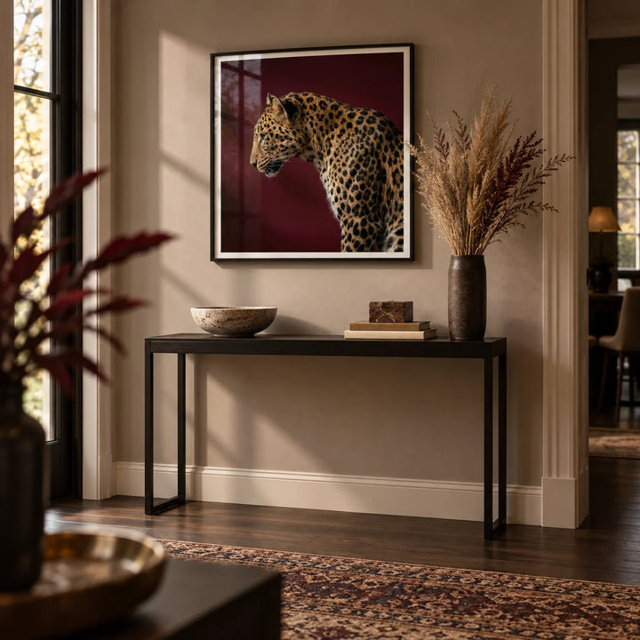 Leopard Art Print, framed on the wall of an elegant hallway with a warm taupe wall and dark wood floorboards
