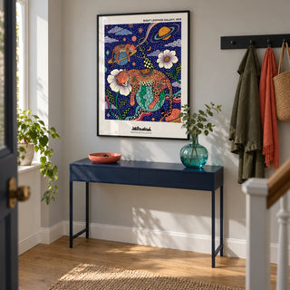 Leopard Galaxy Art Print, framed on the wall of a characterful entrance hallway in a contemporary UK flat with pale grey walls and a simple oak floor