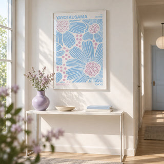 Light Blue Wall Art, framed on the wall of a bright hallway with a white wall