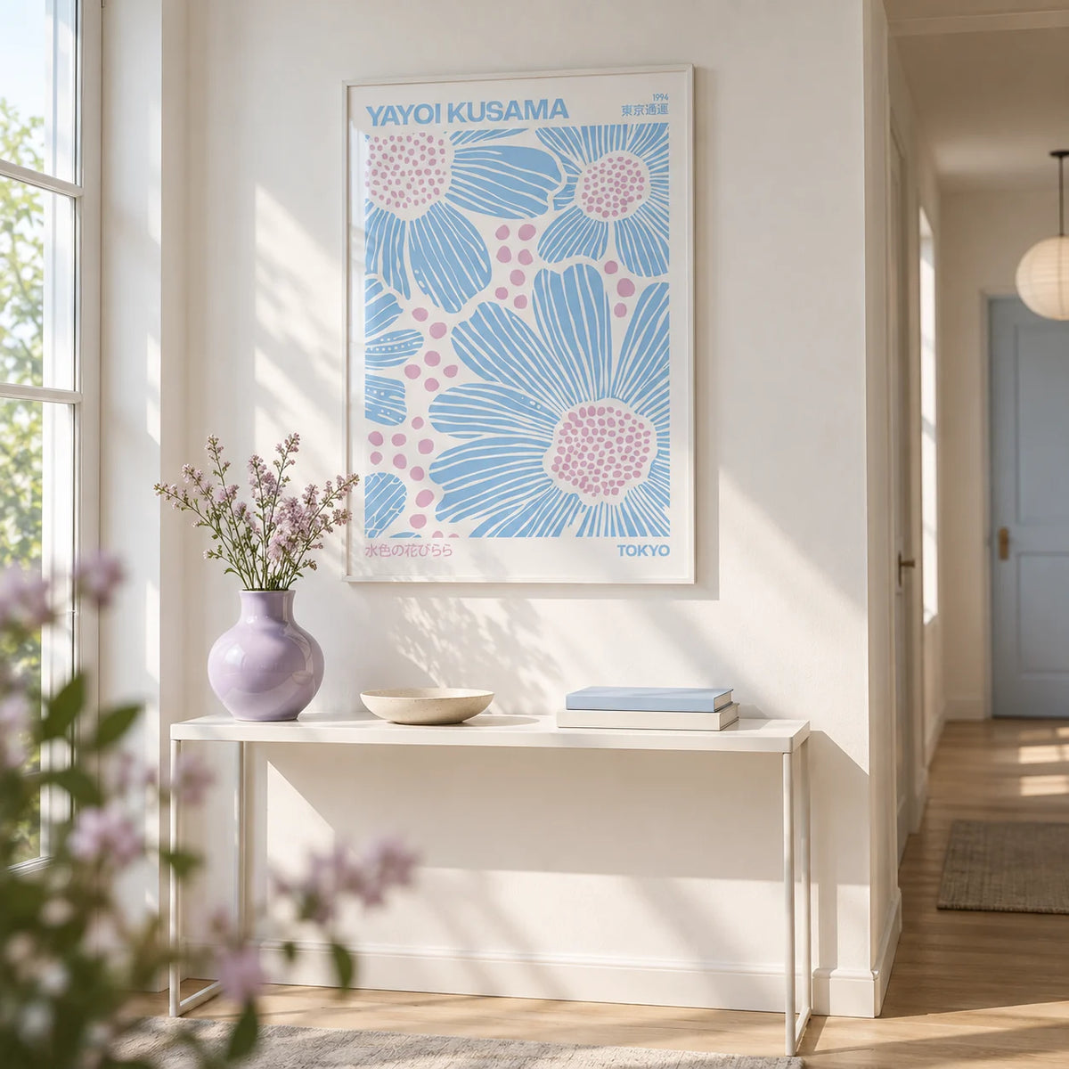 Light Blue Wall Art, framed on the wall of a bright hallway with a white wall