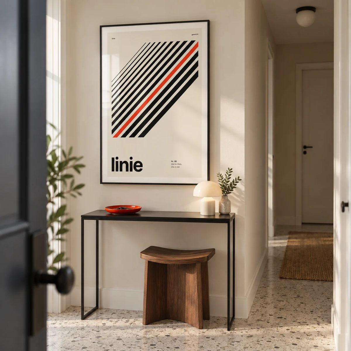Line Print, framed on the wall of a crisp entrance hallway in a UK apartment with a cream wall and pale terrazzo floor