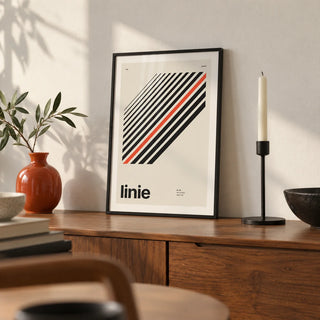 Line Print, a small A4 framed print leaning on a walnut sideboard in a living room
