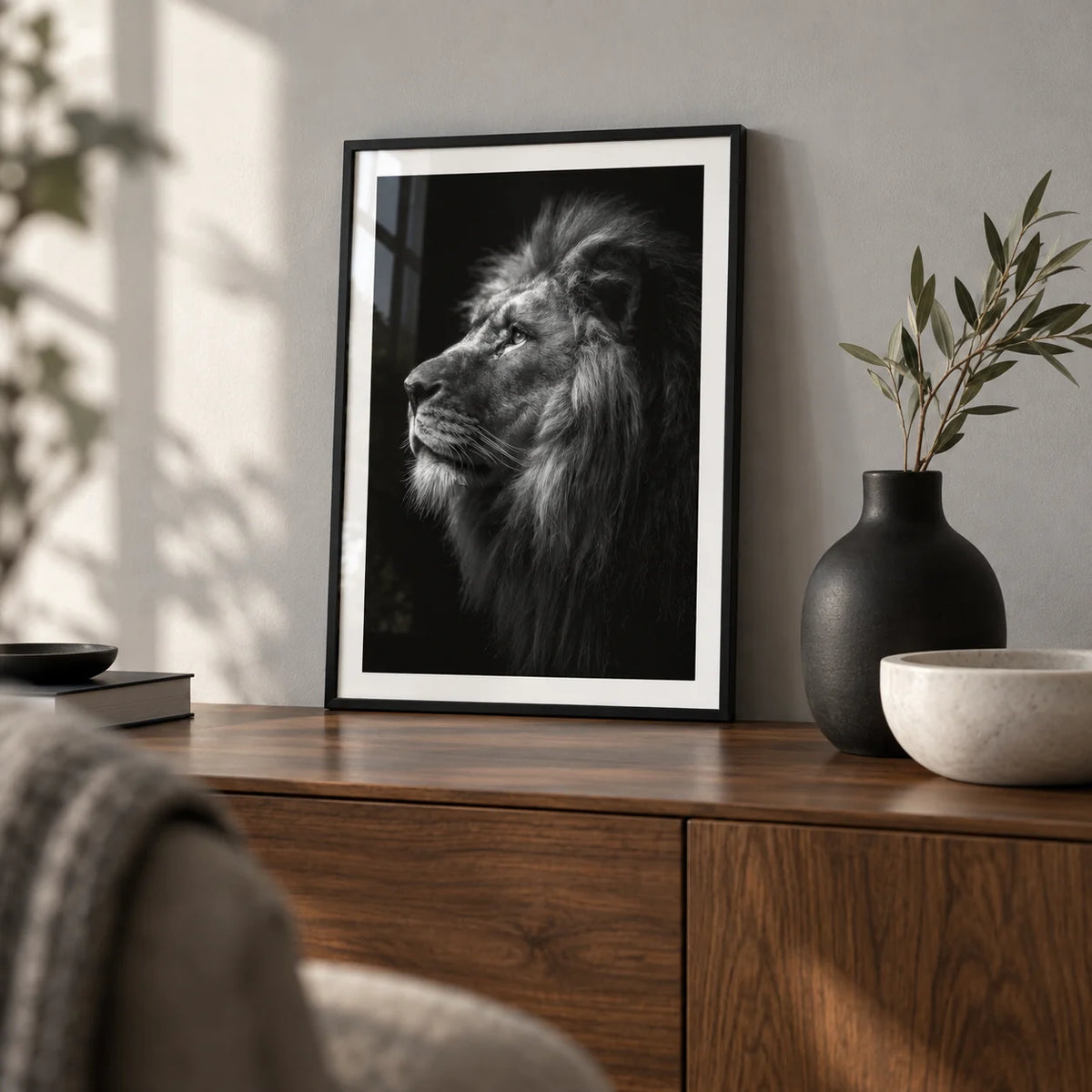 Lion Wall Art, a small A4 framed print leaning on a walnut sideboard in a living room