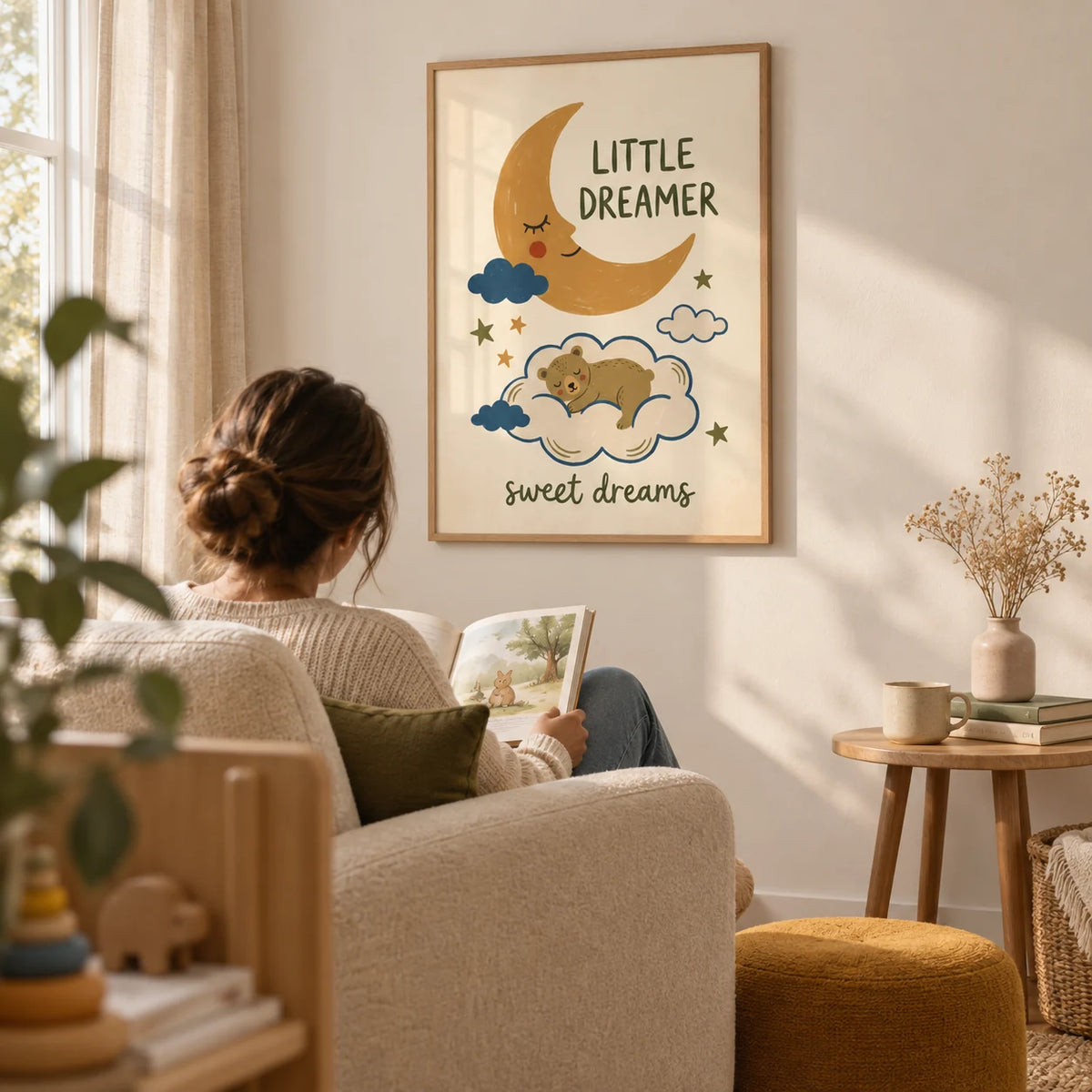 Little Dreamer Wall Art, framed on the wall of a quiet nursery reading corner with a warm white wall and natural linen curtains