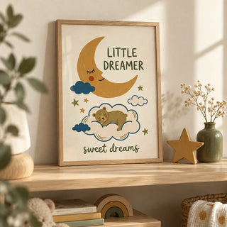 Little Dreamer Wall Art, a small A4 framed print leaning on a pale oak nursery shelf