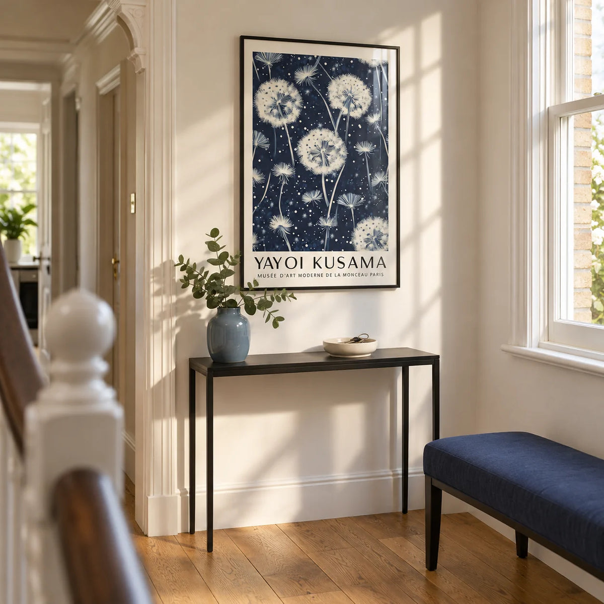 Living Room Prints, framed on the wall of a bright narrow hallway in a UK Victorian terrace with warm white walls and oak floorboards