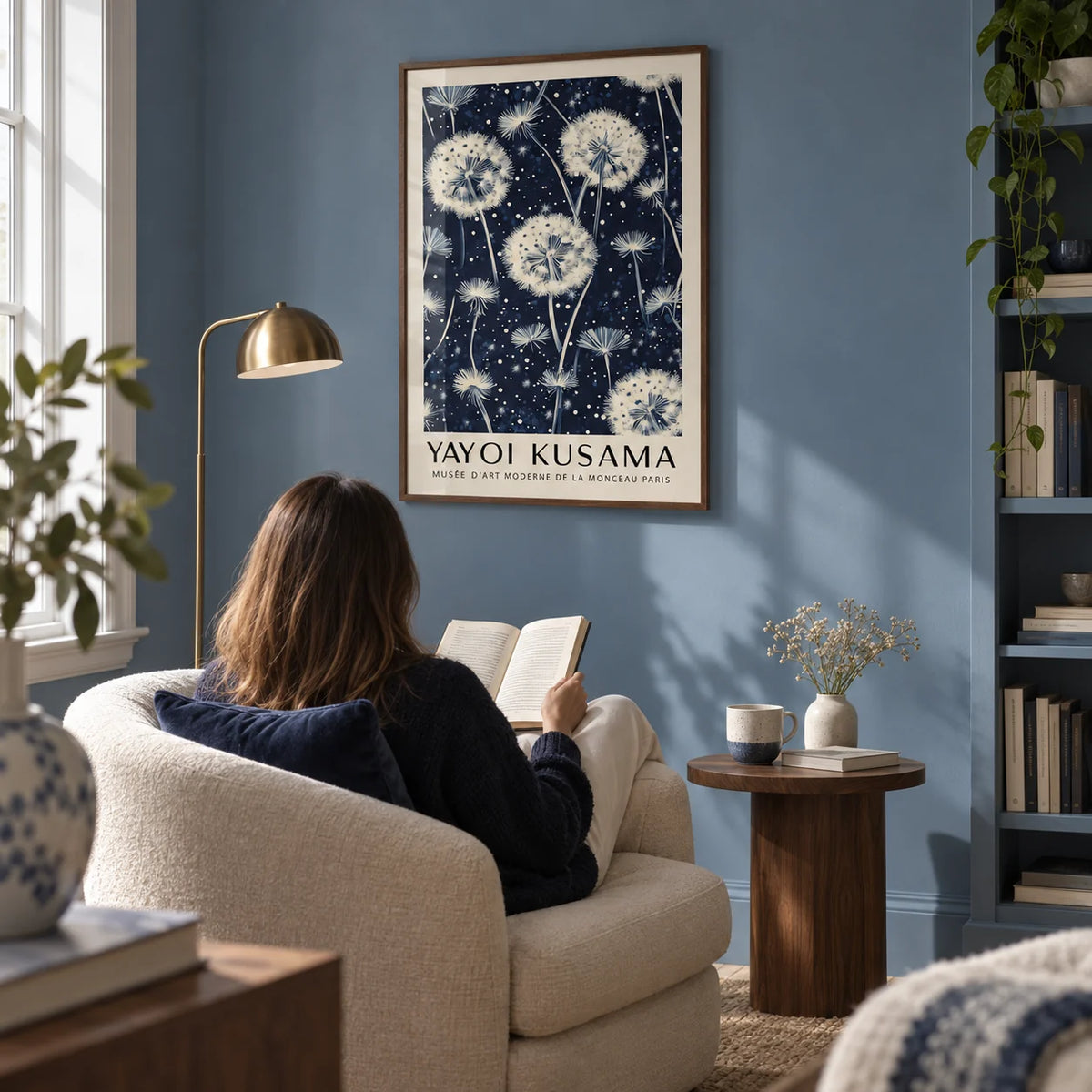 Living Room Prints, framed on the wall of a quiet reading corner in a contemporary UK flat with a muted blue wall