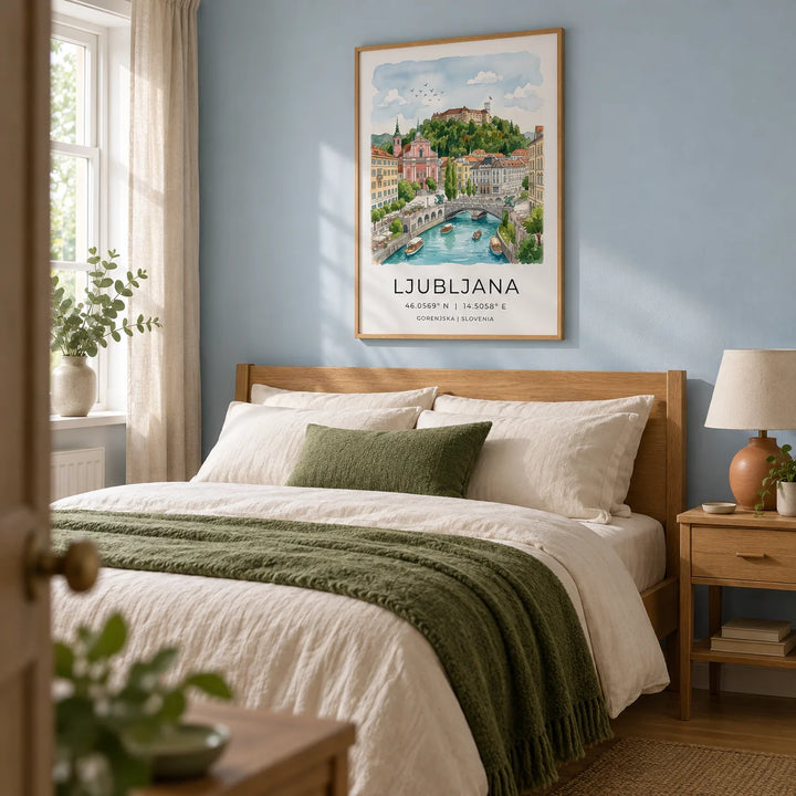 Ljubljana Art Print, framed on the wall of a peaceful bedroom in a modest British home with a pale blue wall and warm oak furniture