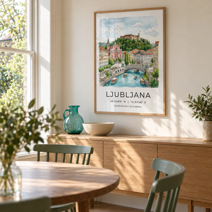 Ljubljana Art Print, framed on the wall of a relaxed dining room in a renovated terrace with a soft cream wall and a garden-facing sash window