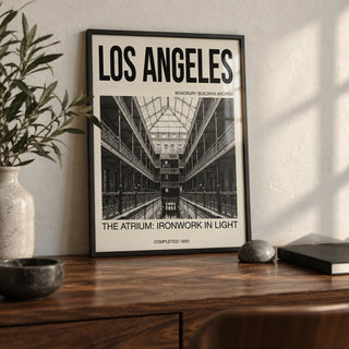Los Angeles Architecture Art Print, a small A4 framed print leaning on a walnut desk