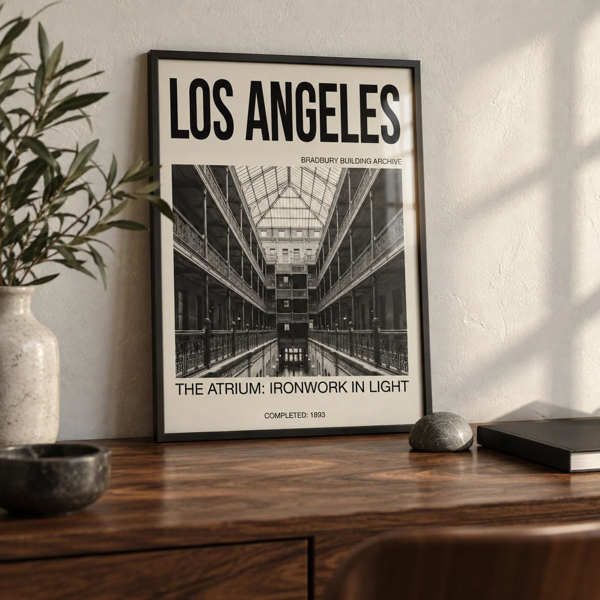 Los Angeles Architecture Art Print, a small A4 framed print leaning on a walnut desk