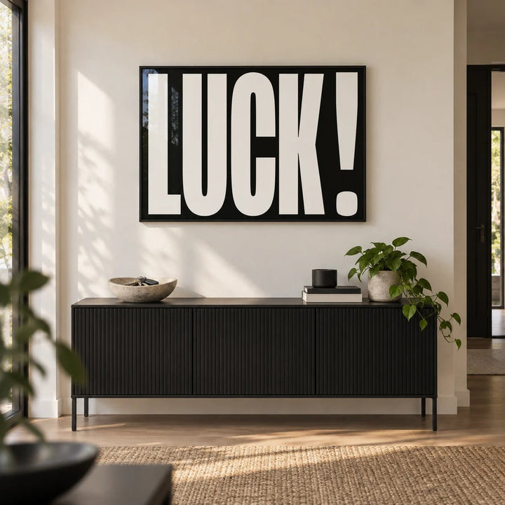 Lucky Gifts, framed on the wall of a crisp modern hallway with a warm white wall