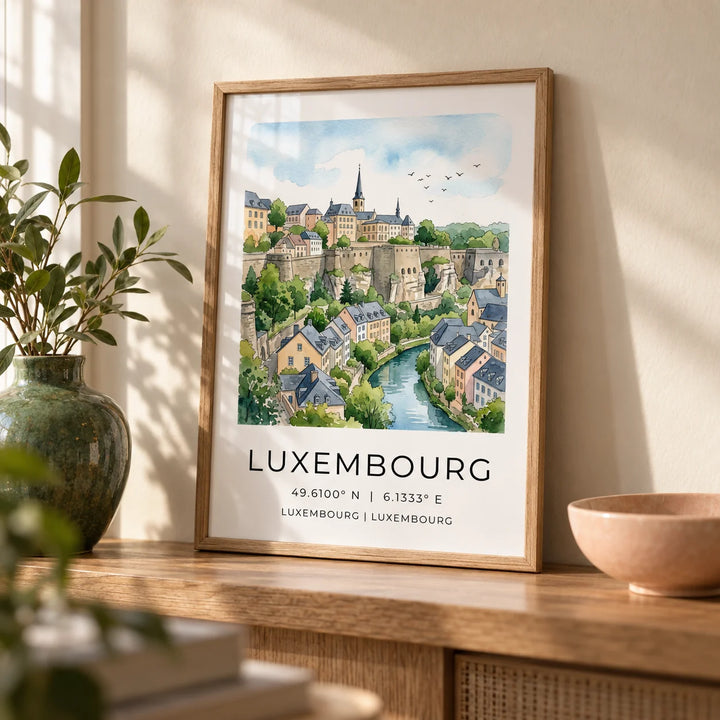 Luxembourg City Wall Art, a small A4 framed print leaning on an oak shelf in a living room