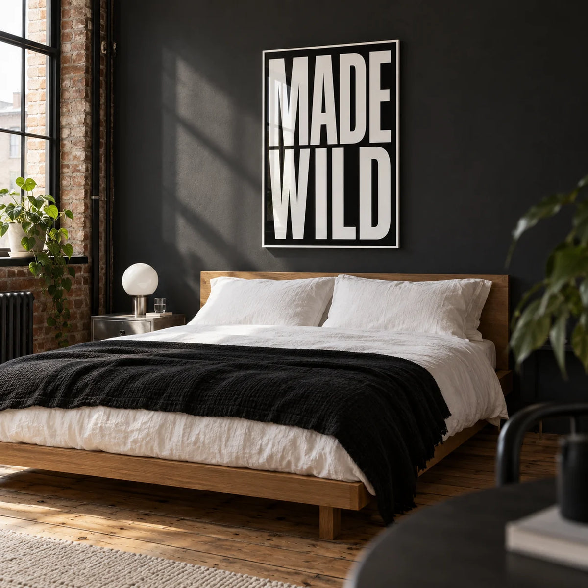 Made Wild Art Print, framed on the wall of a crisp modern bedroom in a converted UK warehouse flat with a charcoal painted wall and exposed timber floorboards