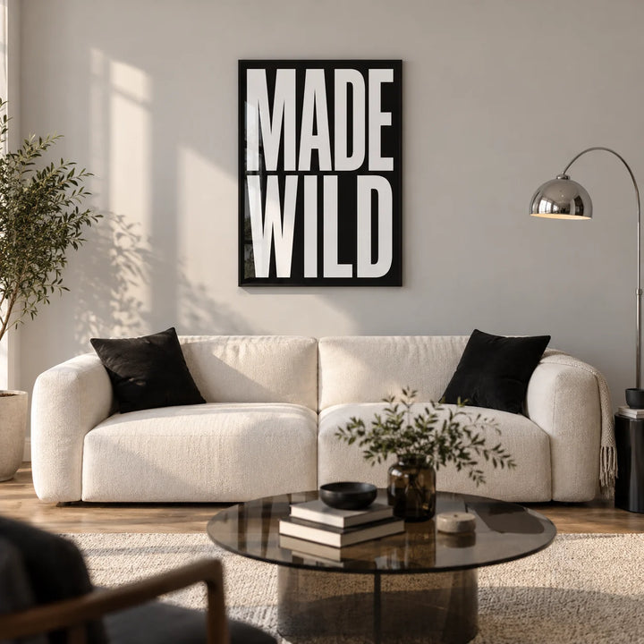 Made Wild Art Print, framed on the wall of a modern living room in a young creative's UK city flat with a pale grey wall and warm oak floor