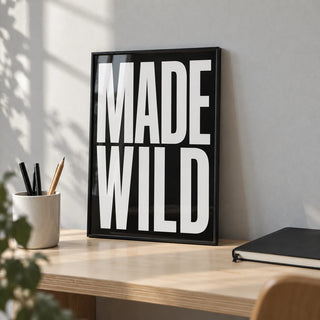 Made Wild Art Print, a small A4 framed print leaning on a birch plywood desk