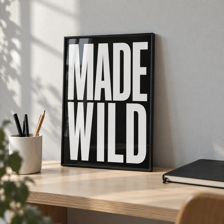 Made Wild Art Print, a small A4 framed print leaning on a birch plywood desk