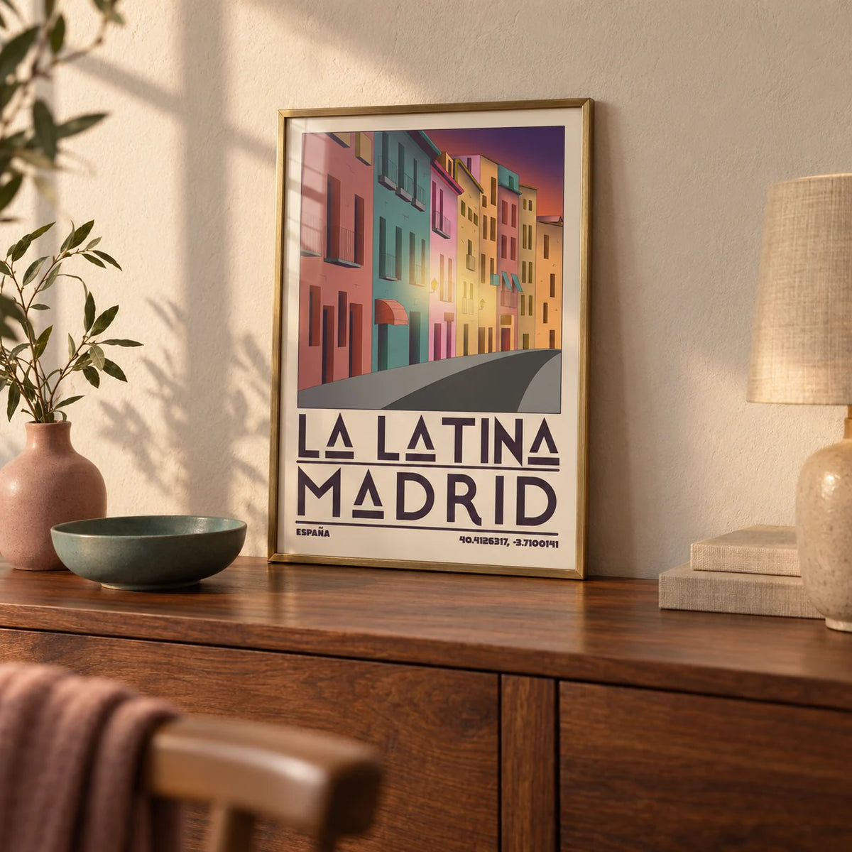 Madrid City Wall Art, a small A4 framed print leaning on a walnut sideboard in a living room