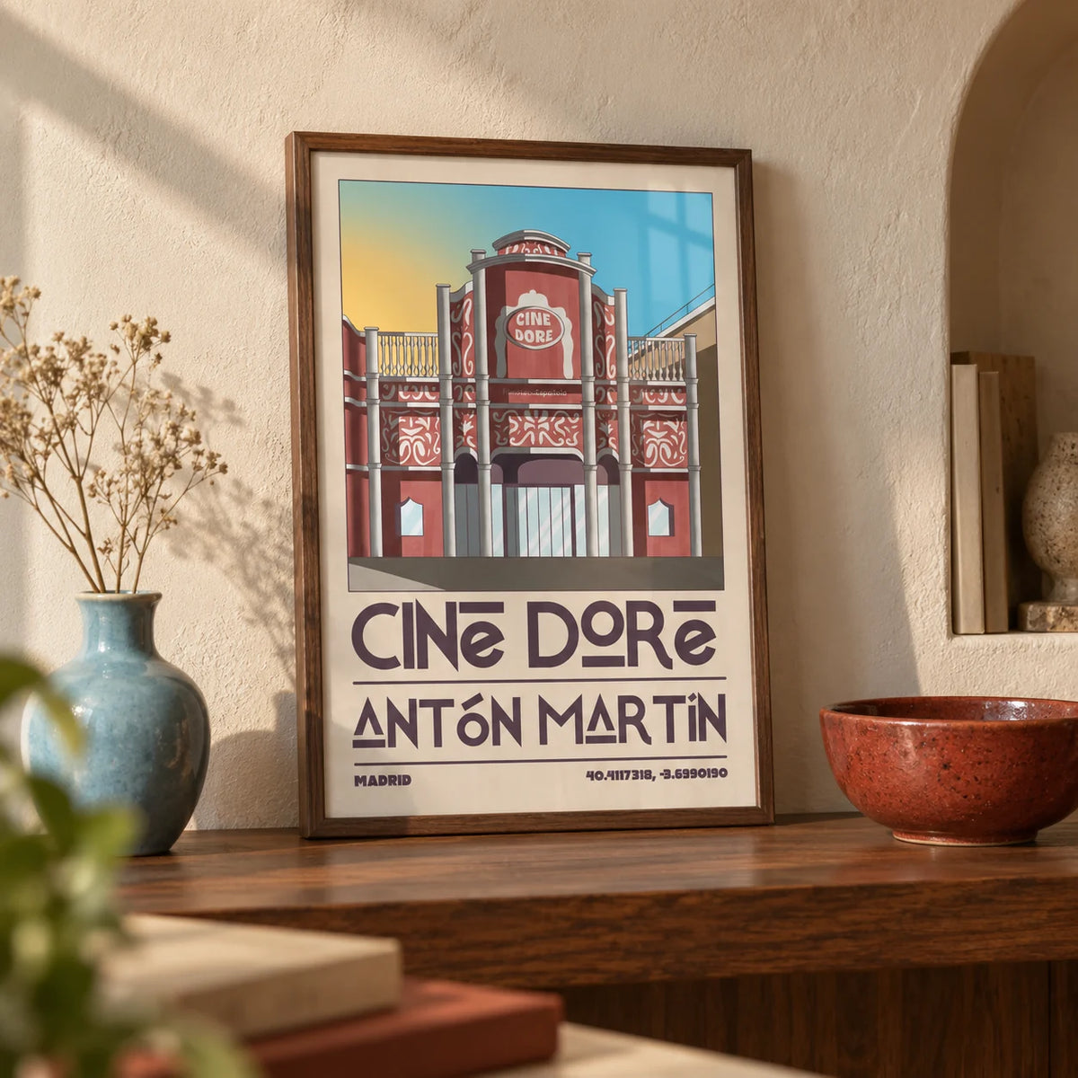 Madrid Landmark Poster, a small A4 framed print leaning on a walnut shelf in a living room