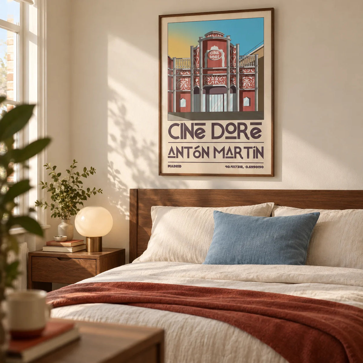 Madrid Landmark Poster, framed on the wall of a warm bedroom for a travel-loving couple in a UK flat with a pale cream wall and a simple walnut double bed