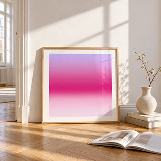 Magenta Print, framed and leaning on the parquet floor of a bright living room