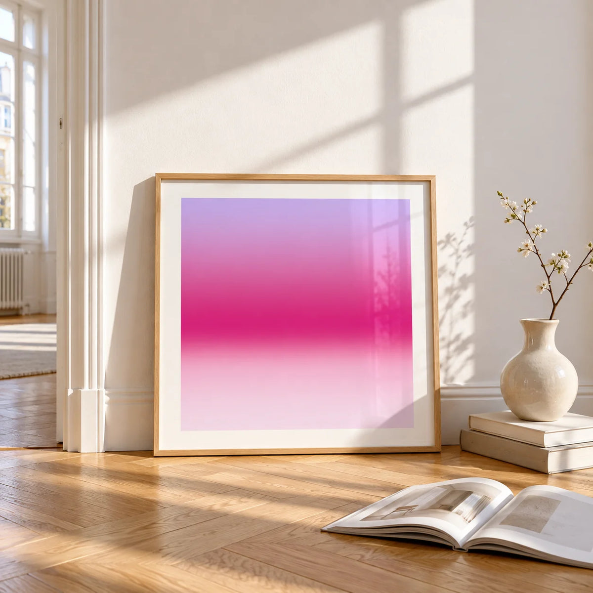 Magenta Print, framed and leaning on the parquet floor of a bright living room