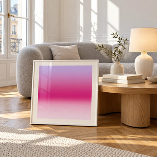 Magenta Print, framed and leaning against a coffee table in a bright living room