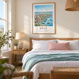 Maldives City Art Print, framed on the wall of a calm coastal bedroom in a UK home with a warm white wall and a woven pendant shade