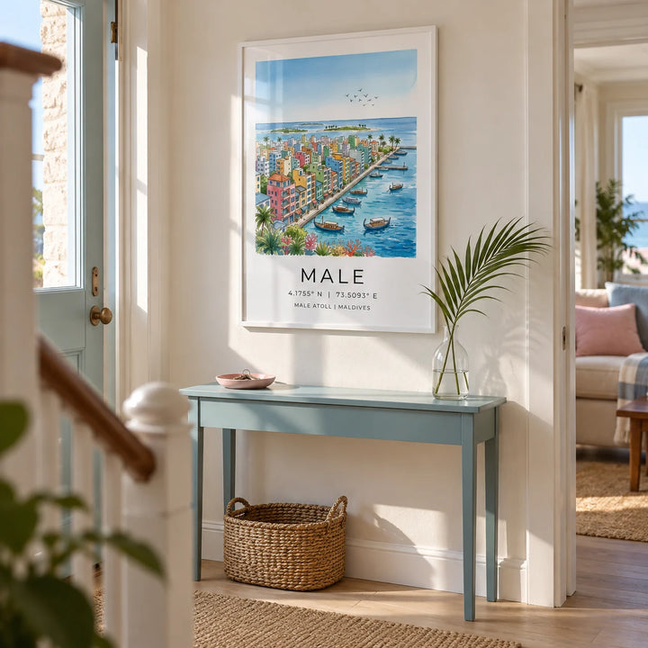 Maldives City Art Print, framed on the wall of a welcoming hallway in a UK seaside terrace with a cream wall and pale oak floorboards