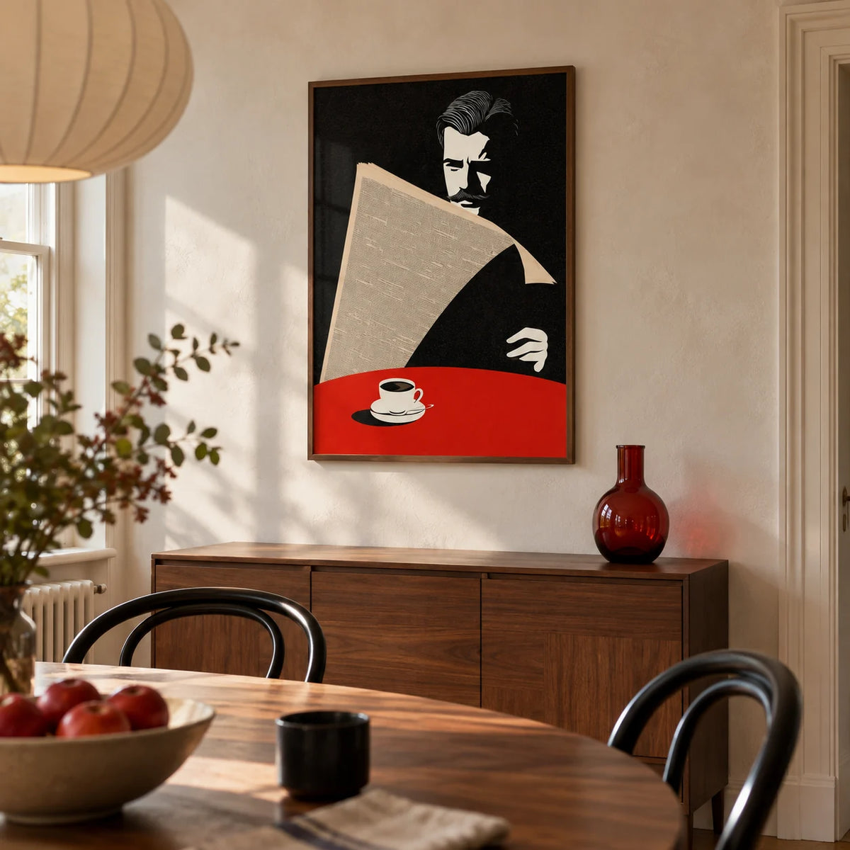 Art Deco Newspaper Reader Print, framed on the wall of a warm modern dining room in a UK terraced house with pale plaster walls and a walnut dining table