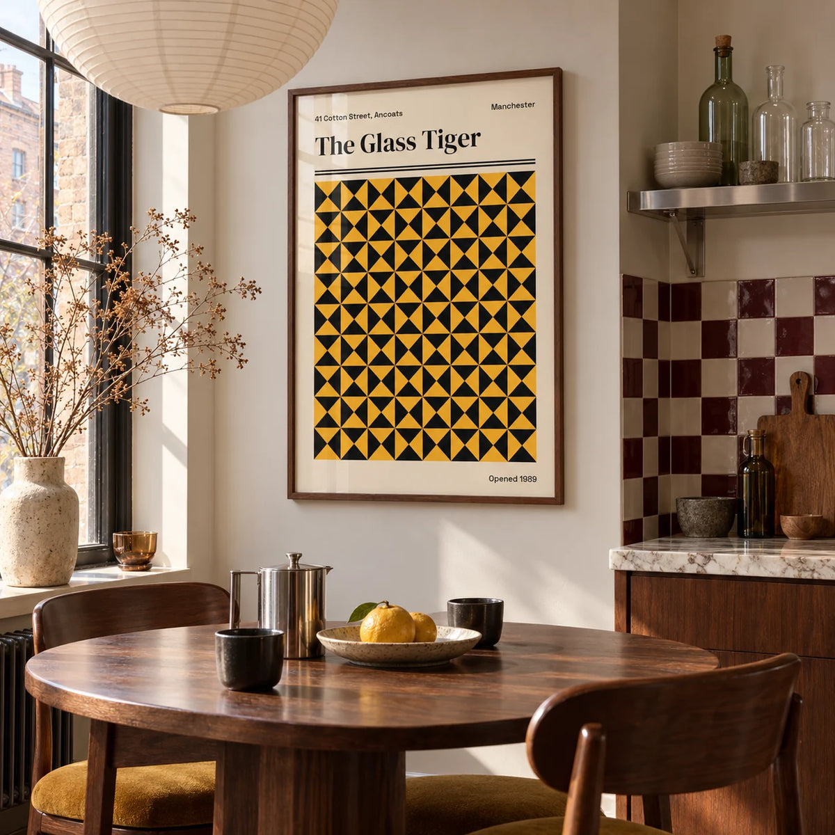 Manchester Art Print, framed on the wall of a kitchen dining corner by a tall window in soft daylight