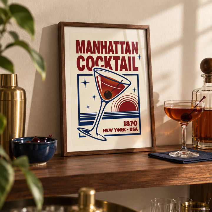 Manhattan Cocktail Art Print, a small A4 framed print leaning on a walnut shelf in a living room