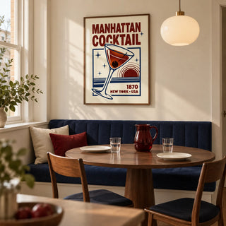 Manhattan Cocktail Art Print, framed on the wall of a small dining room in a UK city flat with a cream wall and a built-in navy banquette