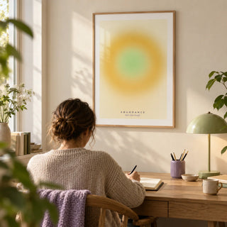 Manifestation Wall Art, framed on the wall of a quiet home study with a pale cream wall and a simple oak desk