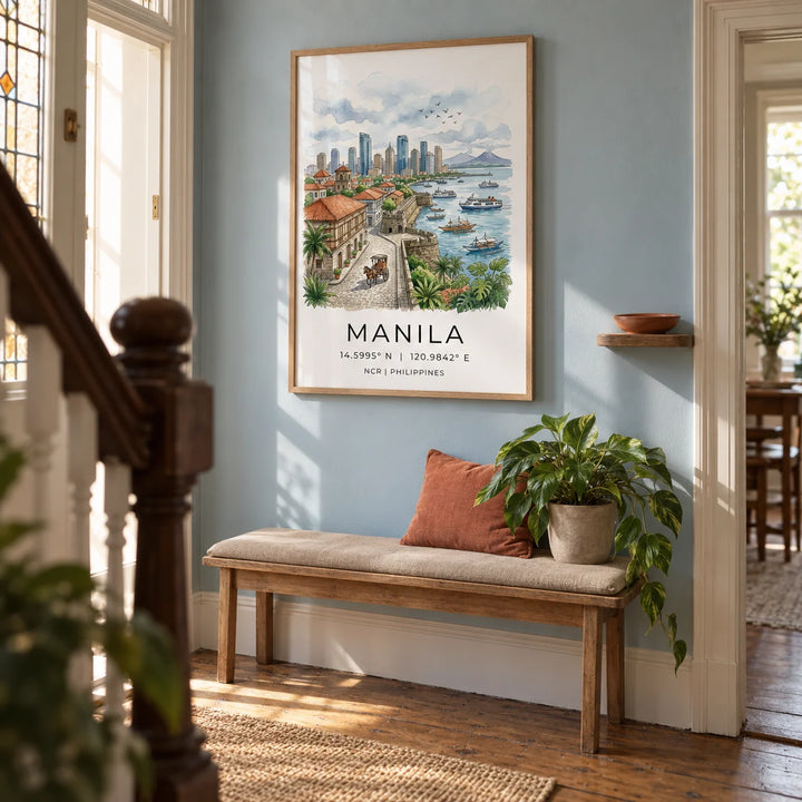 Manila City Art Print, framed on the wall of a welcoming hallway in a Victorian UK terrace with a muted pale blue wall and restored timber floorboards