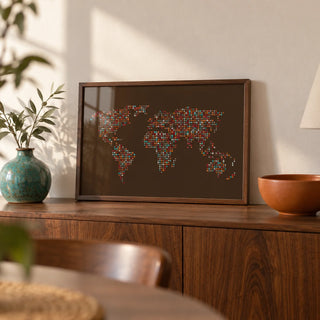 Map Of The World Poster, a small A4 framed print leaning on a walnut sideboard in a living room