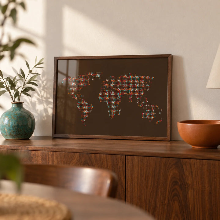 Map Of The World Poster, a small A4 framed print leaning on a walnut sideboard in a living room