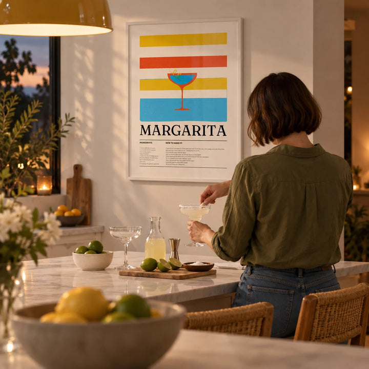 Margarita Wall Art, framed on the wall of a bright kitchen with a white island