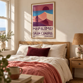 Maspalomas Vintage Wall Art, framed on the wall of a relaxed bedroom in a British coastal home with warm cream walls and a woven bedside lampshade
