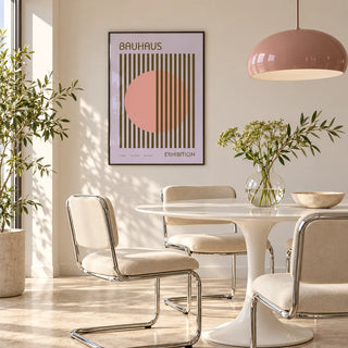MCM Wall Art, framed on the wall of a bright dining room with a pink pendant and chrome chairs