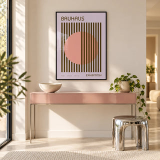 MCM Wall Art, framed on the wall of a bright hallway with a pink side table