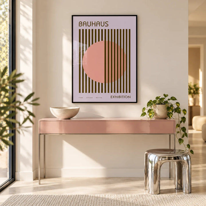 MCM Wall Art, framed on the wall of a bright hallway with a pink side table