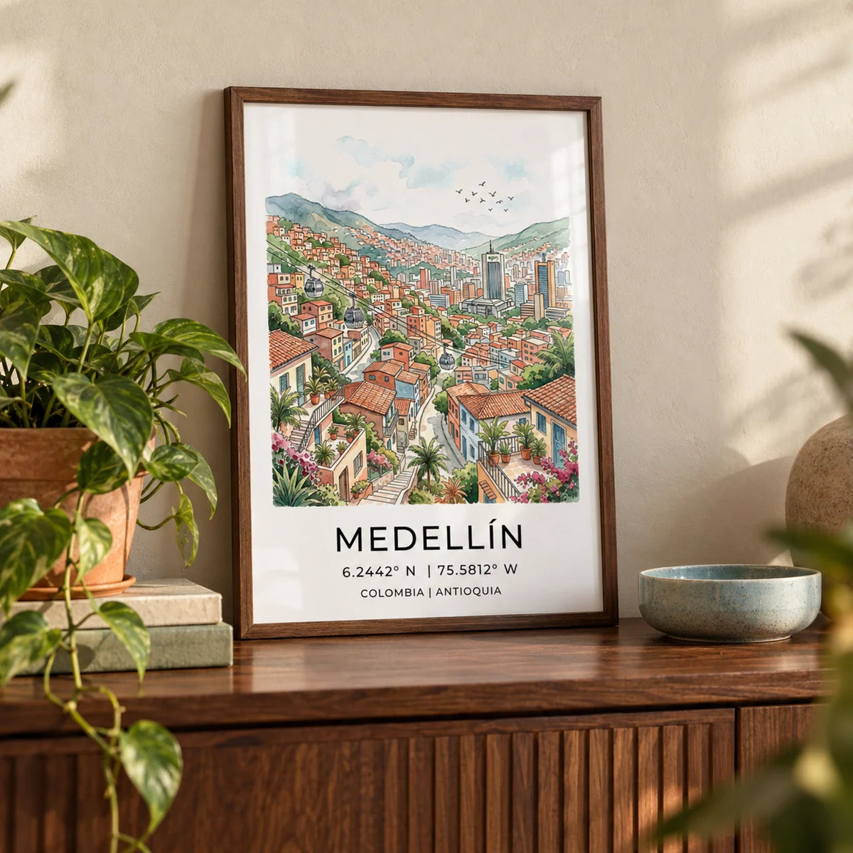 Medellin City Art Print, a small A4 framed print leaning on a walnut side table in a hallway