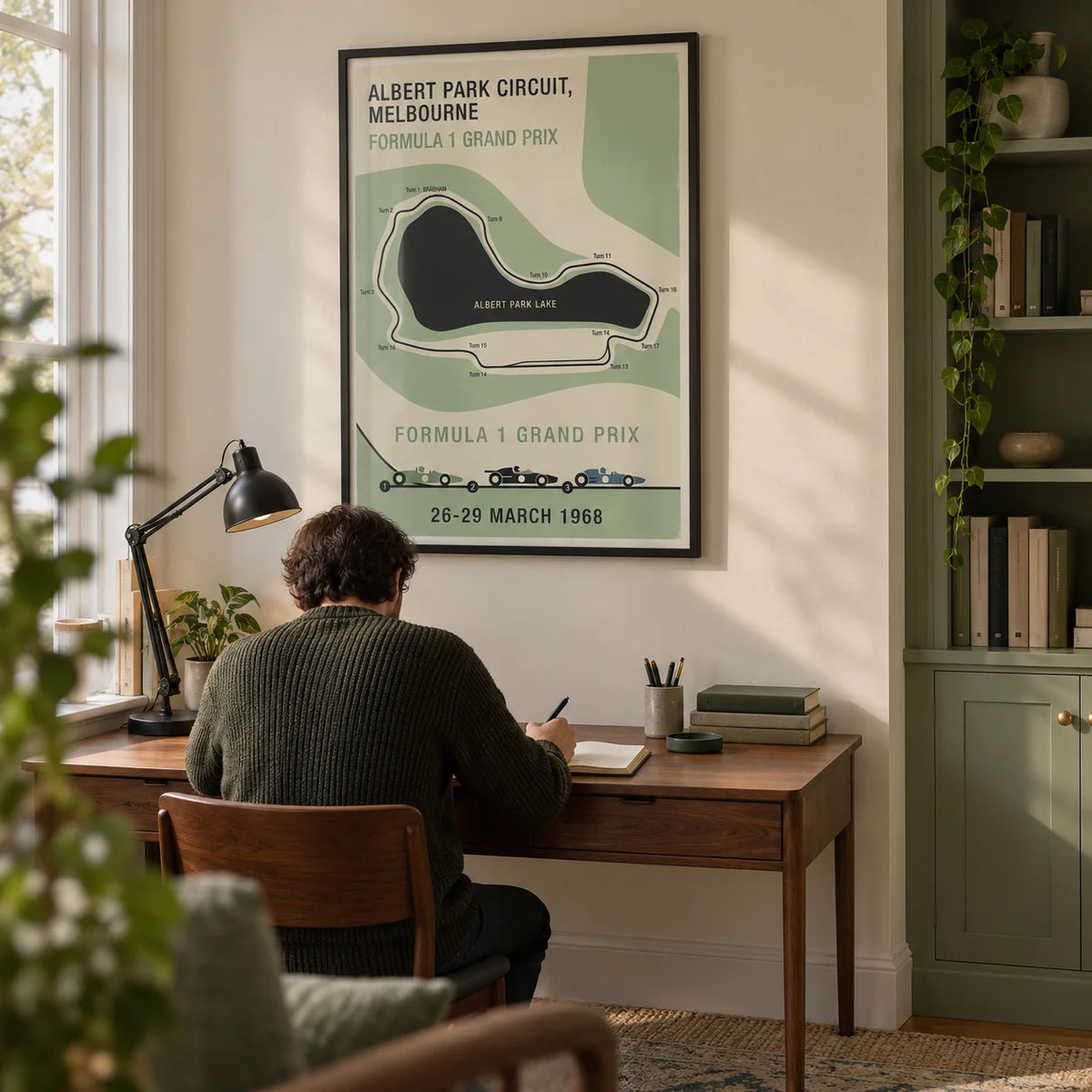 Melbourne Park Circuit Poster, framed on the wall of a quiet home study in a UK terraced house with a pale cream wall and sage green fitted cupboards