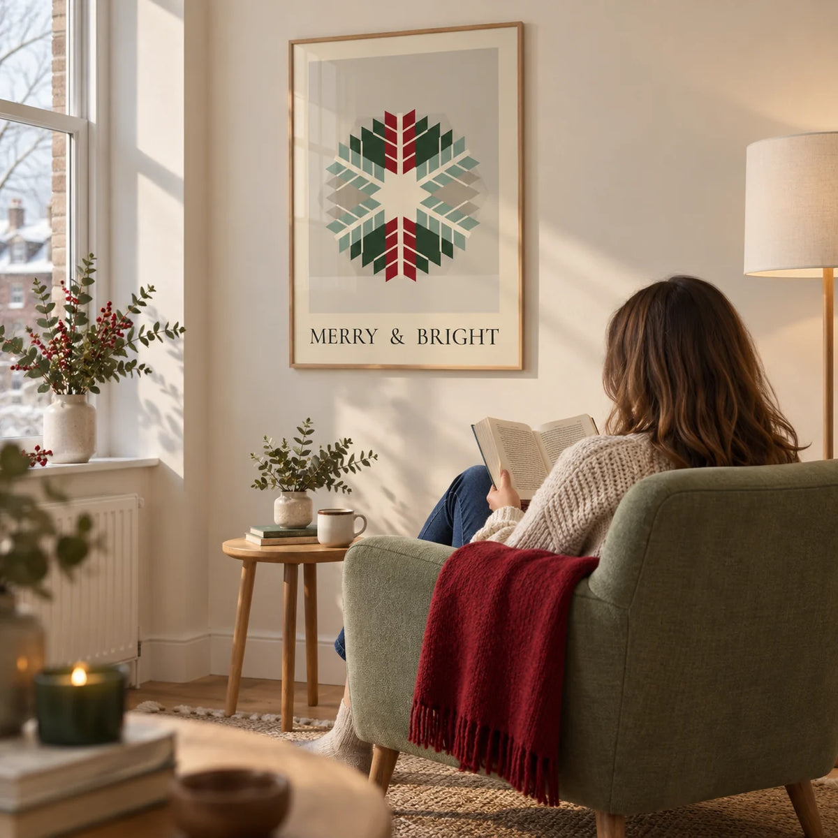 Merry and Bright Print, framed on the wall of a quiet winter reading corner in a modern UK flat with a cream wall in a living room