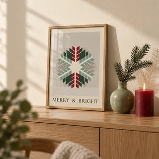 Merry and Bright Print, a small A4 framed print leaning on an oak side table in a hallway