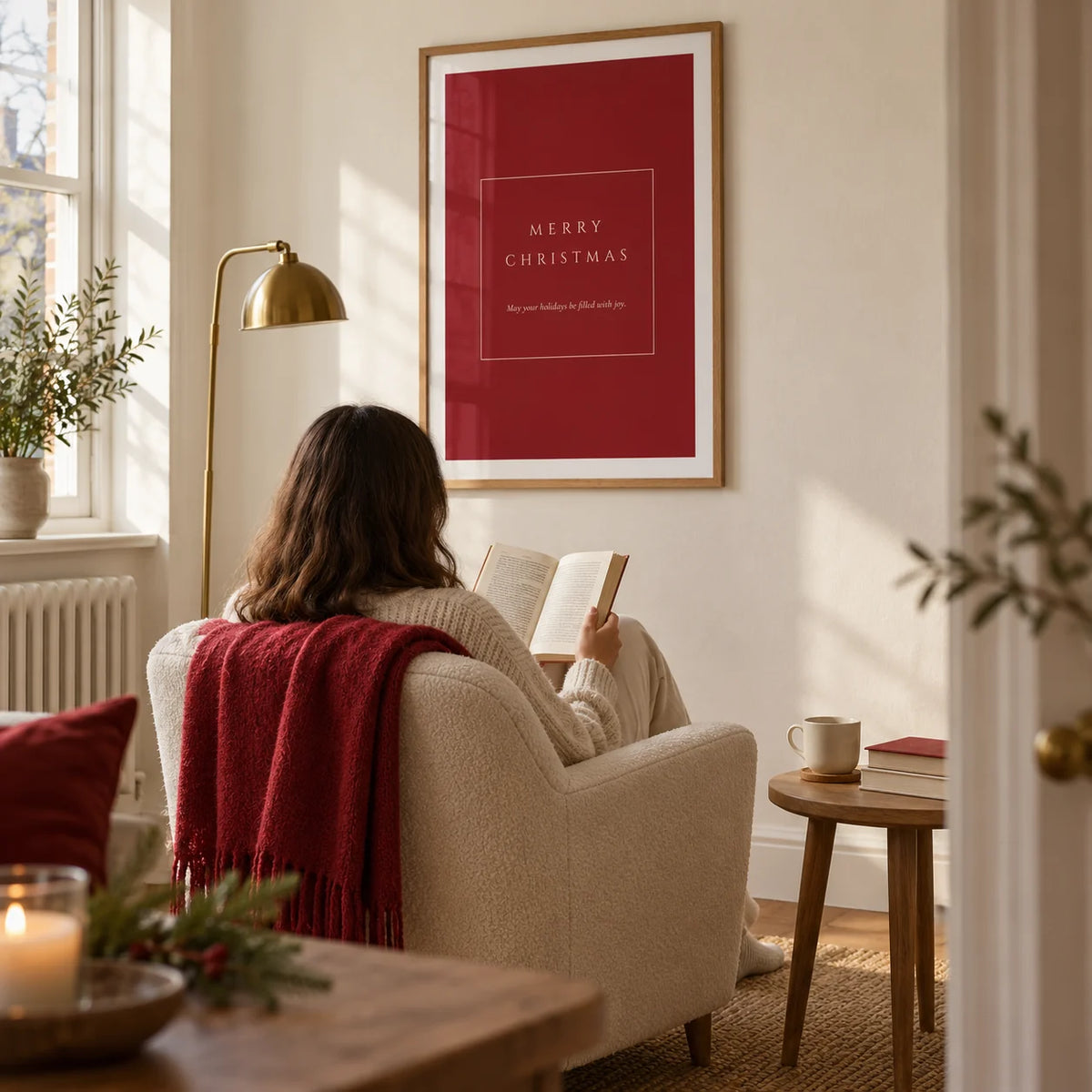 Merry Christmas Poster, framed on the wall of a quiet reading corner in a UK maisonette with a warm white wall and an oak floor in a living room